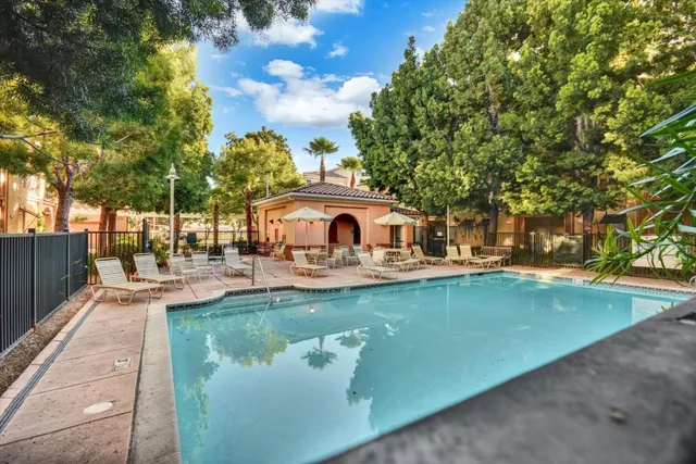 a aerial view of a house with swimming pool and sitting area