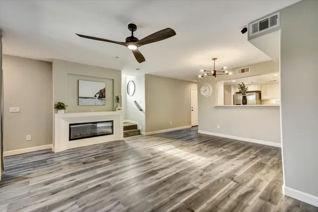 a view of a kitchen with a sink and a stove top oven
