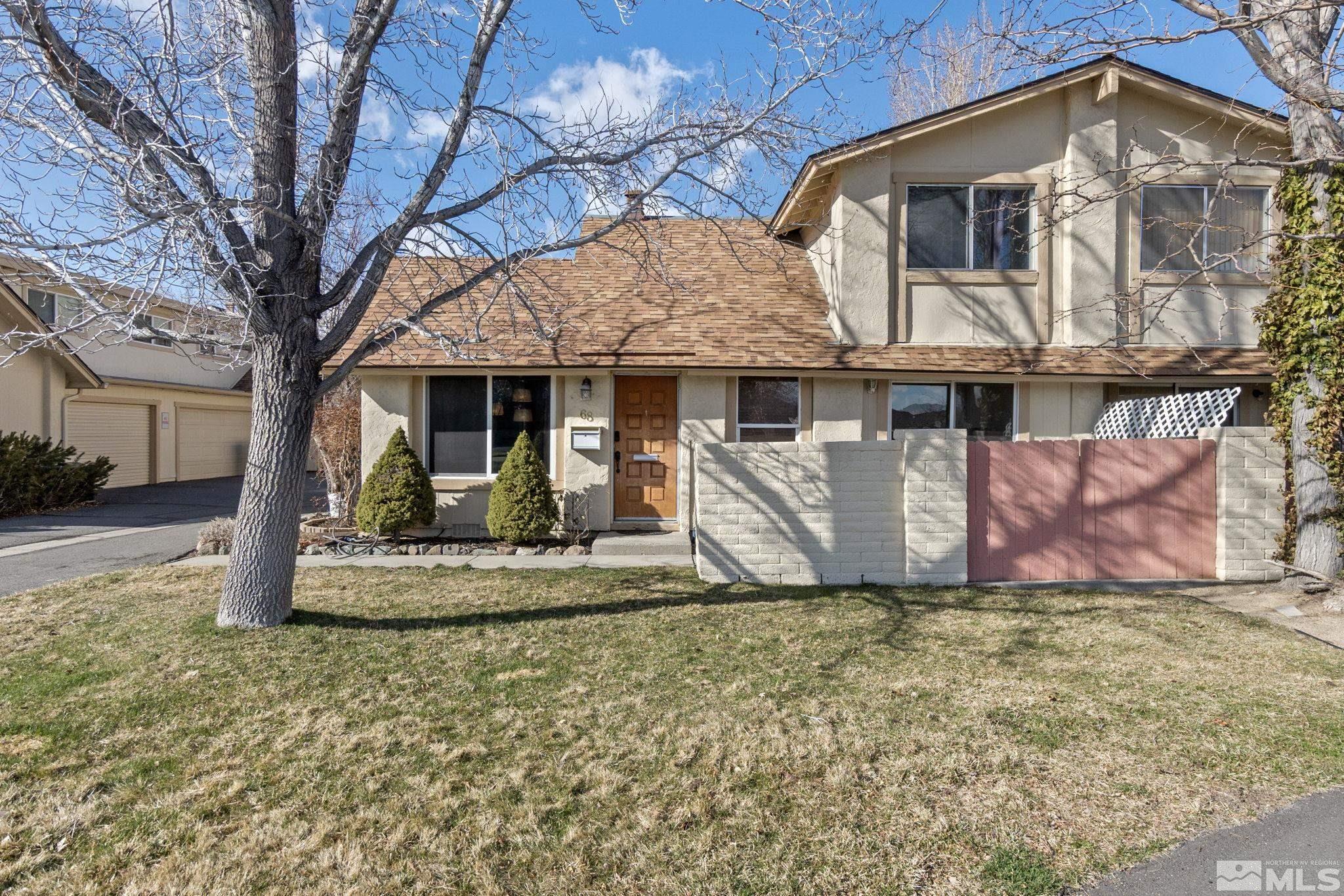 a view of a house with a yard