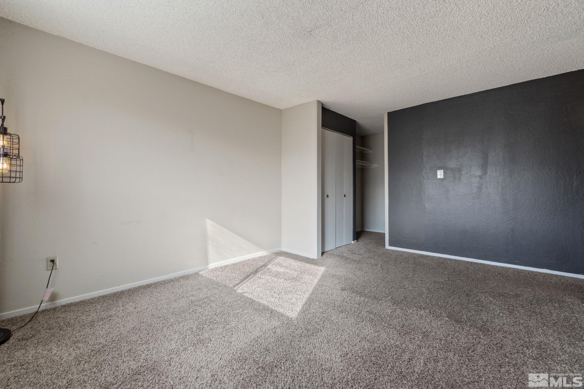 68 Condor Circle Carson City, NV 89701 - Photo 27 of 33 a view of an empty room with a fireplace