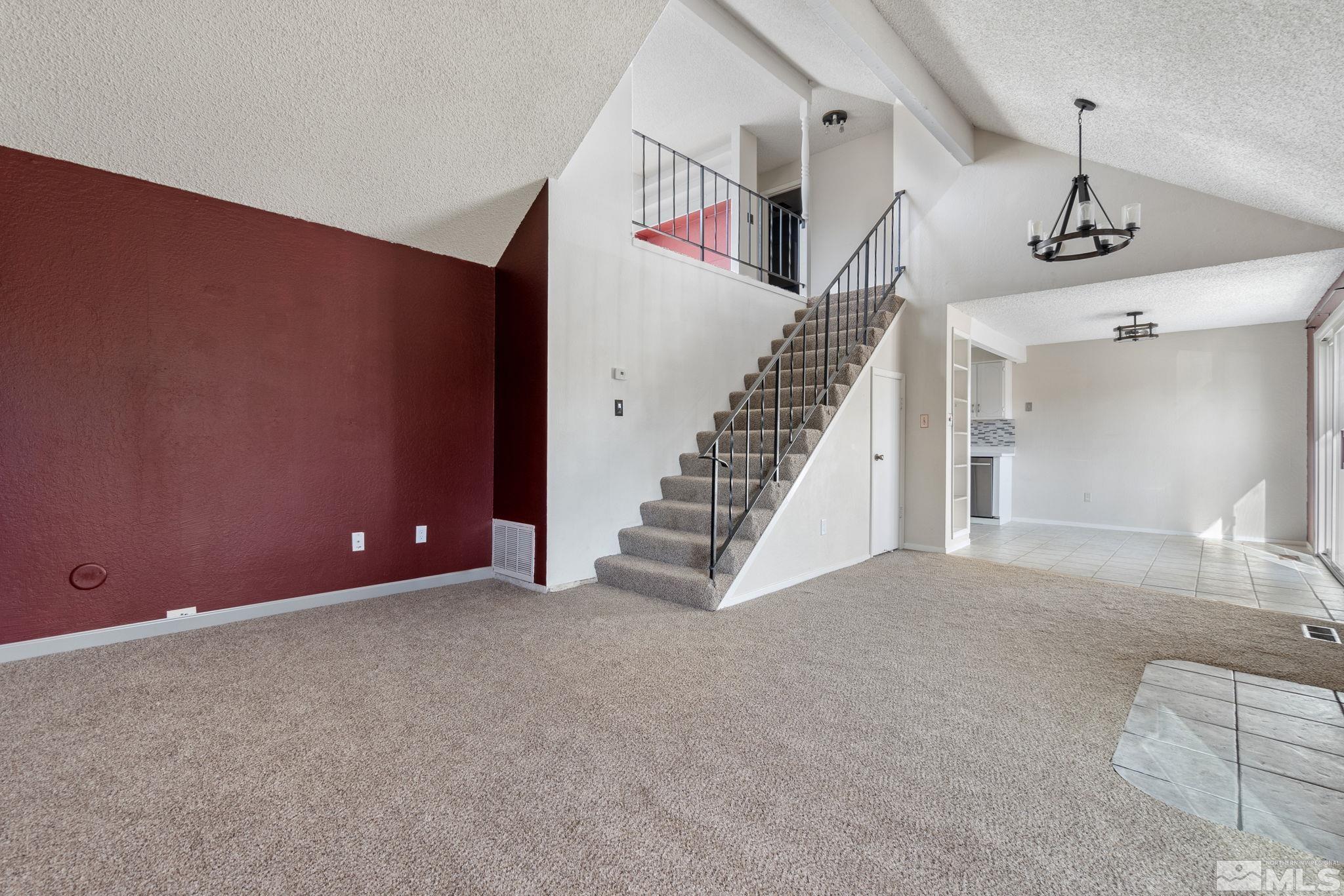 68 Condor Circle Carson City, NV 89701 - Photo 5 of 33 a view of an empty room with stairs