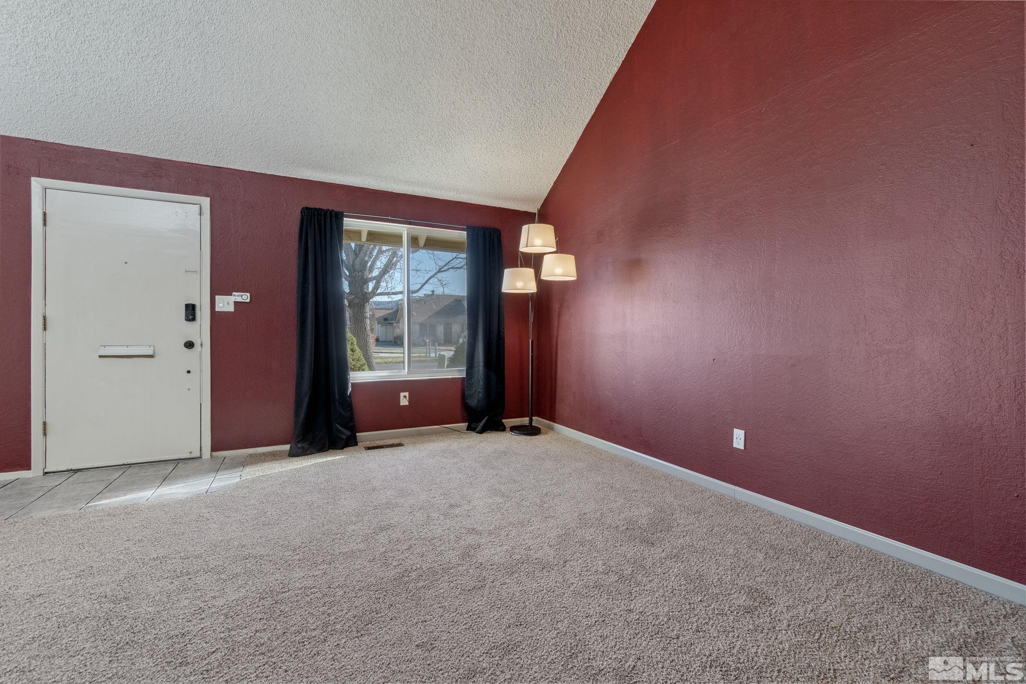 68 Condor Circle Carson City, NV 89701 - Photo 6 of 33 an empty room with entrance and windows