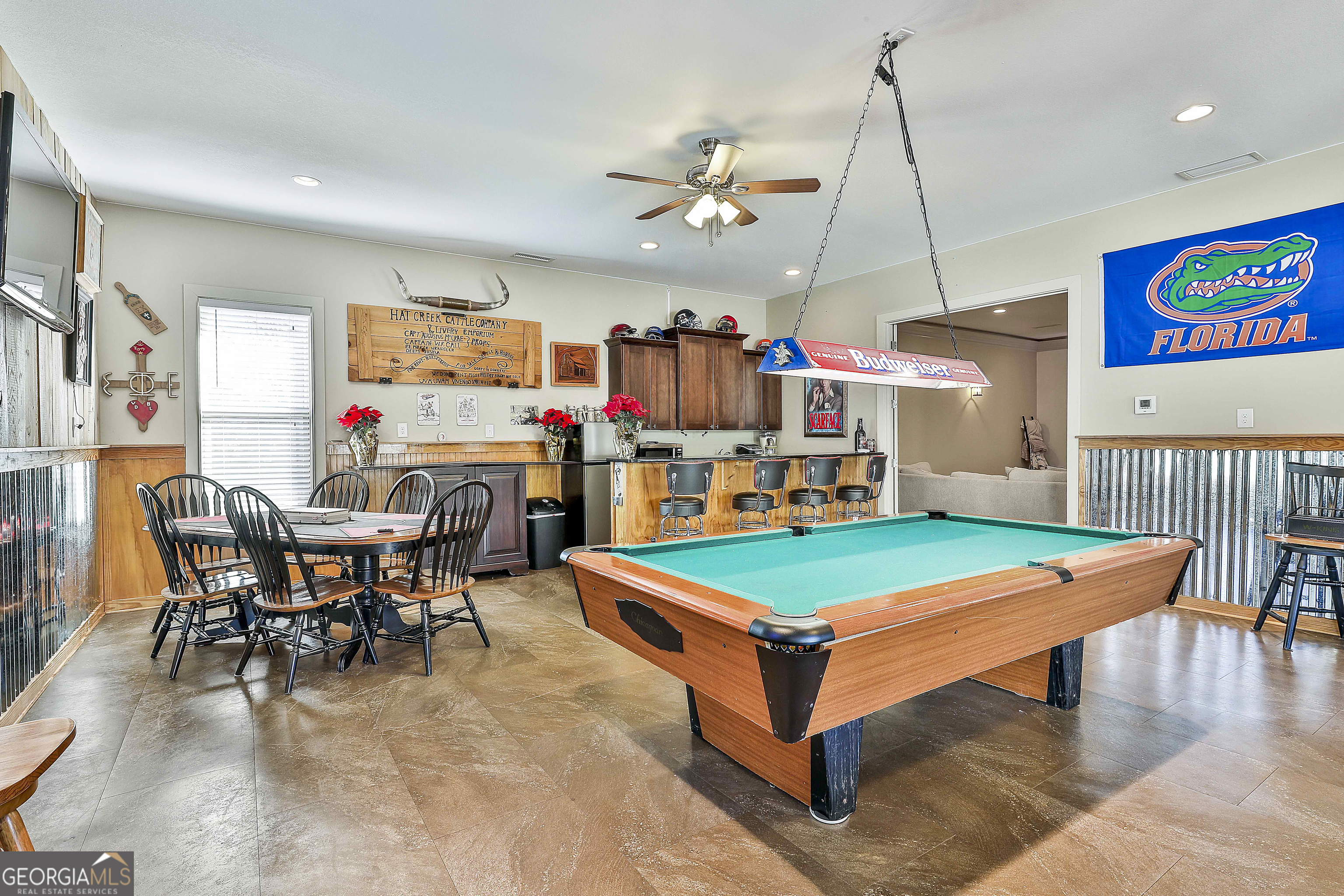 2161 Bear Creek Road Moreland, GA 30259 - Photo 102 of 137 a room with stainless steel appliances kitchen island granite countertop dining table chairs and a large window