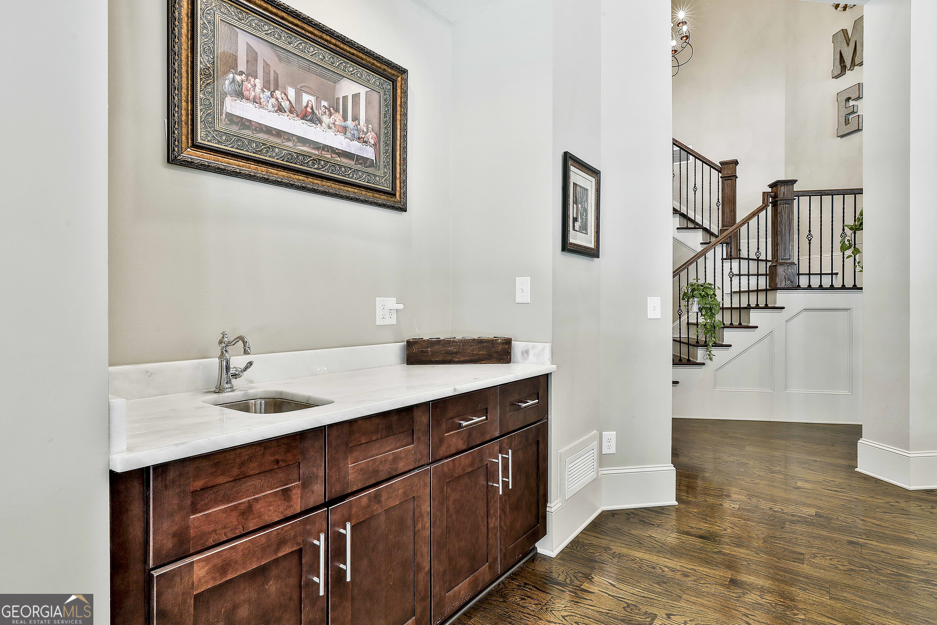 2161 Bear Creek Road Moreland, GA 30259 - Photo 26 of 137 a hallway with a sink and a mirror