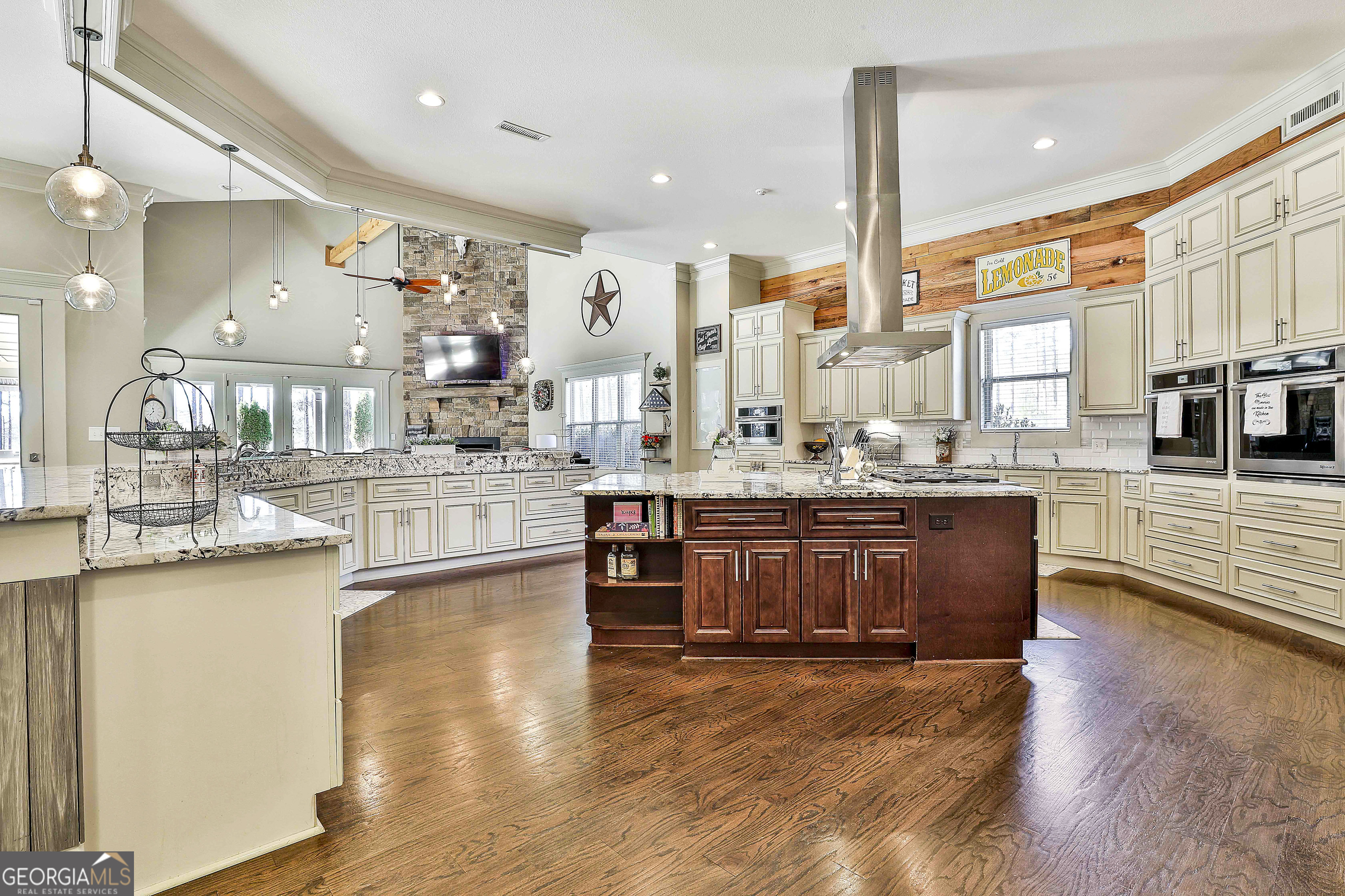 2161 Bear Creek Road Moreland, GA 30259 - Photo 34 of 137 a room with stainless steel appliances kitchen island granite countertop a large cabinets and wooden floor