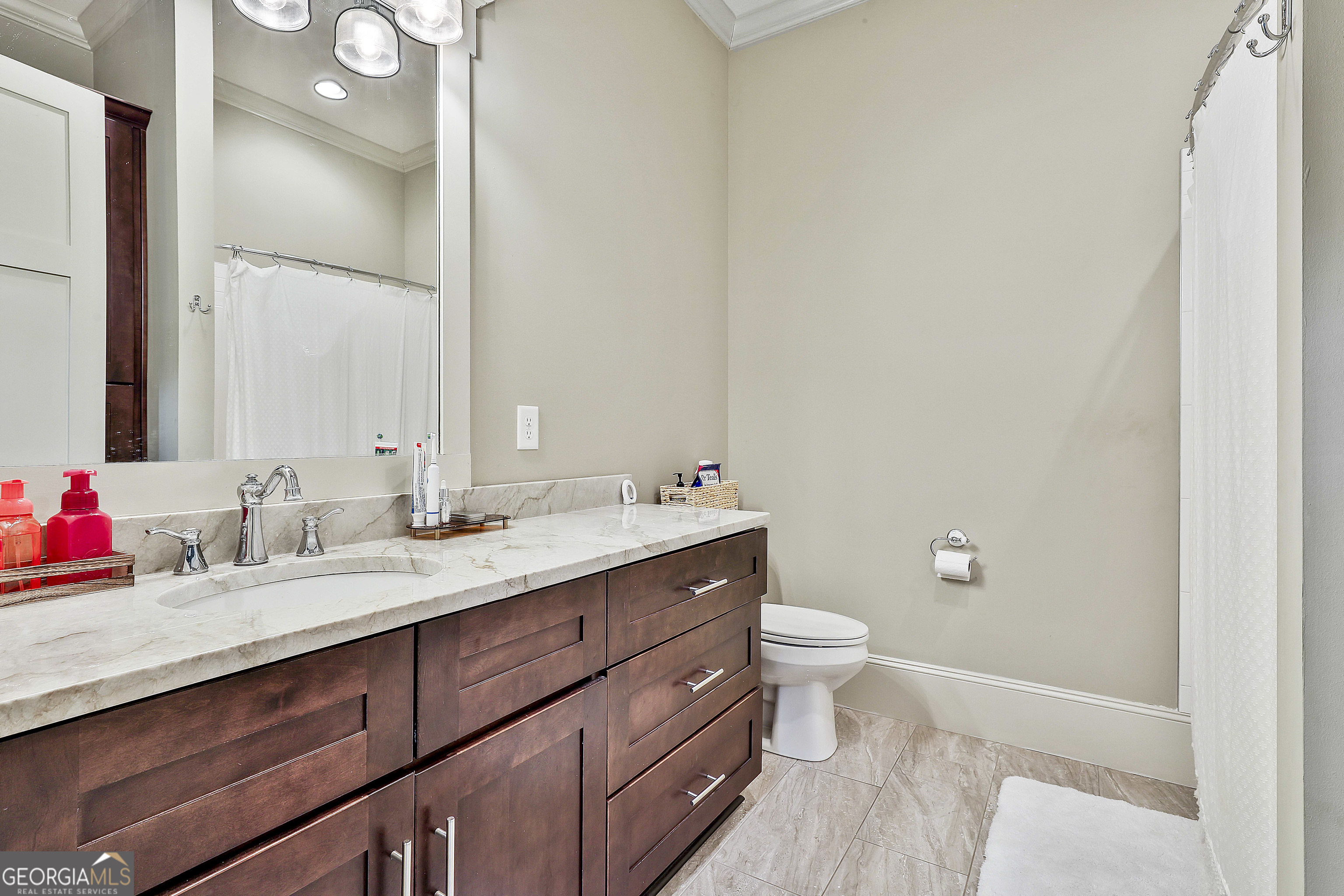2161 Bear Creek Road Moreland, GA 30259 - Photo 50 of 137 a bathroom with a double vanity sink toilet and a mirror