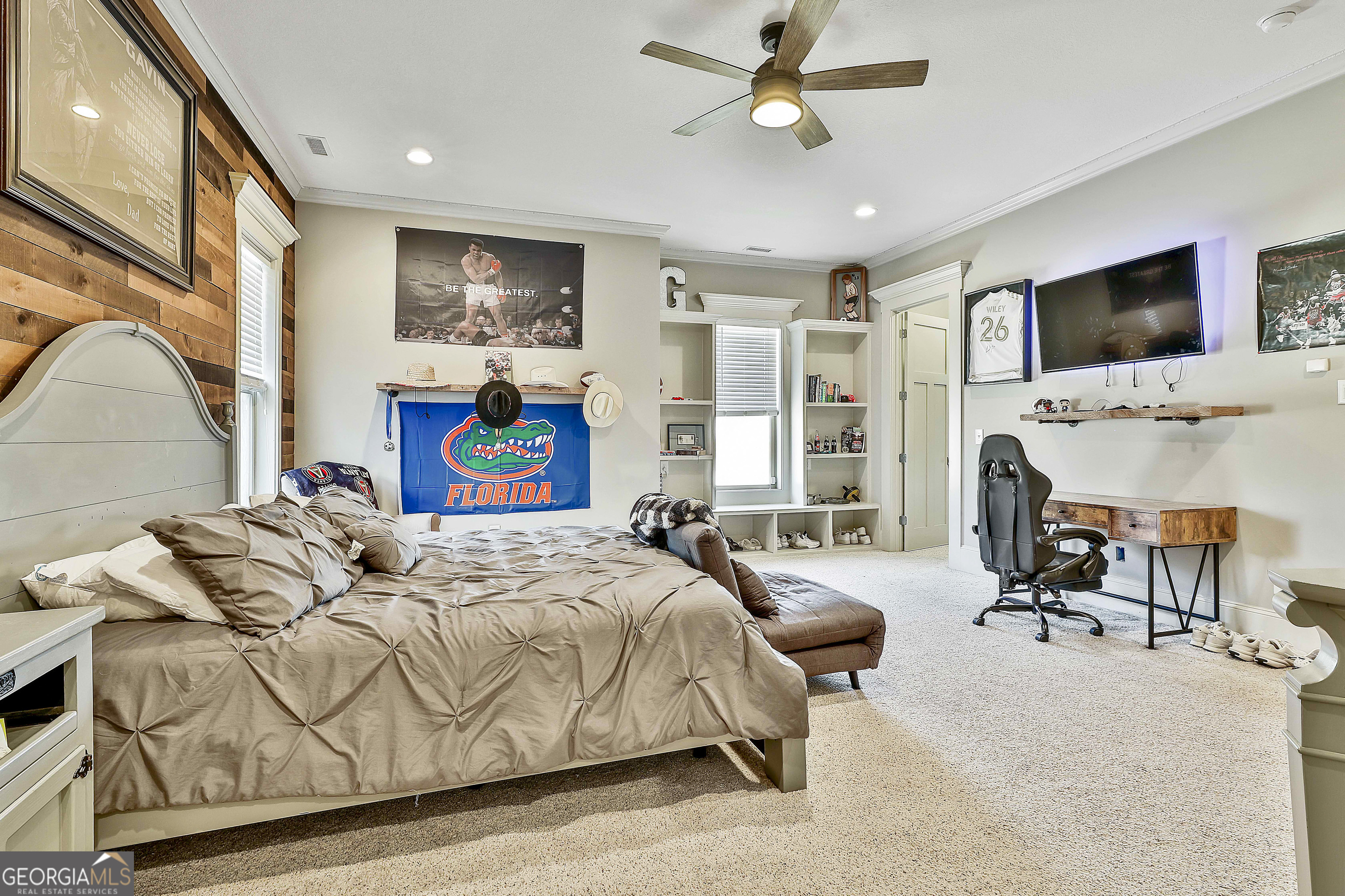 2161 Bear Creek Road Moreland, GA 30259 - Photo 56 of 137 a bedroom with a bed a flat screen tv and couches