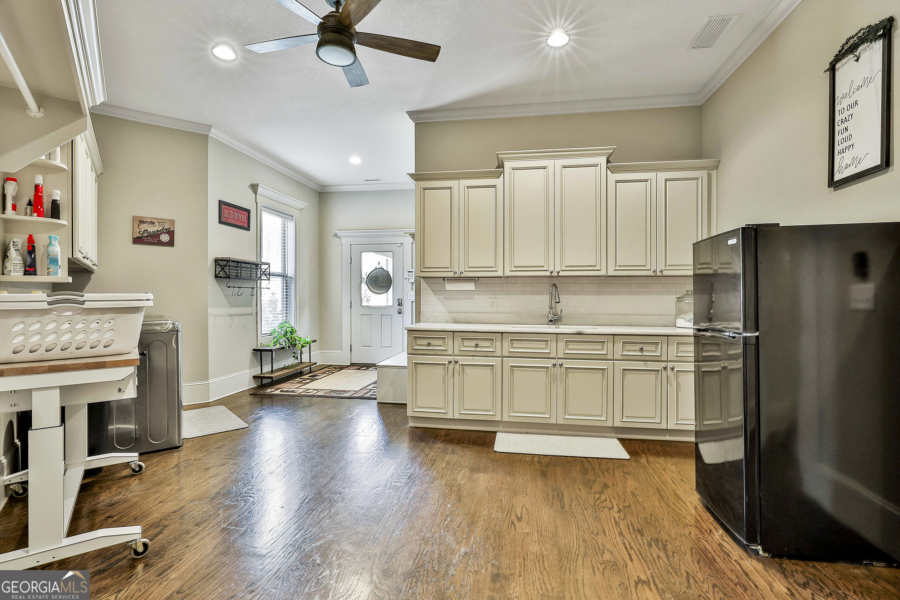 2161 Bear Creek Road Moreland, GA 30259 - Photo 59 of 137 a kitchen with stainless steel appliances a stove a refrigerator and a fireplace