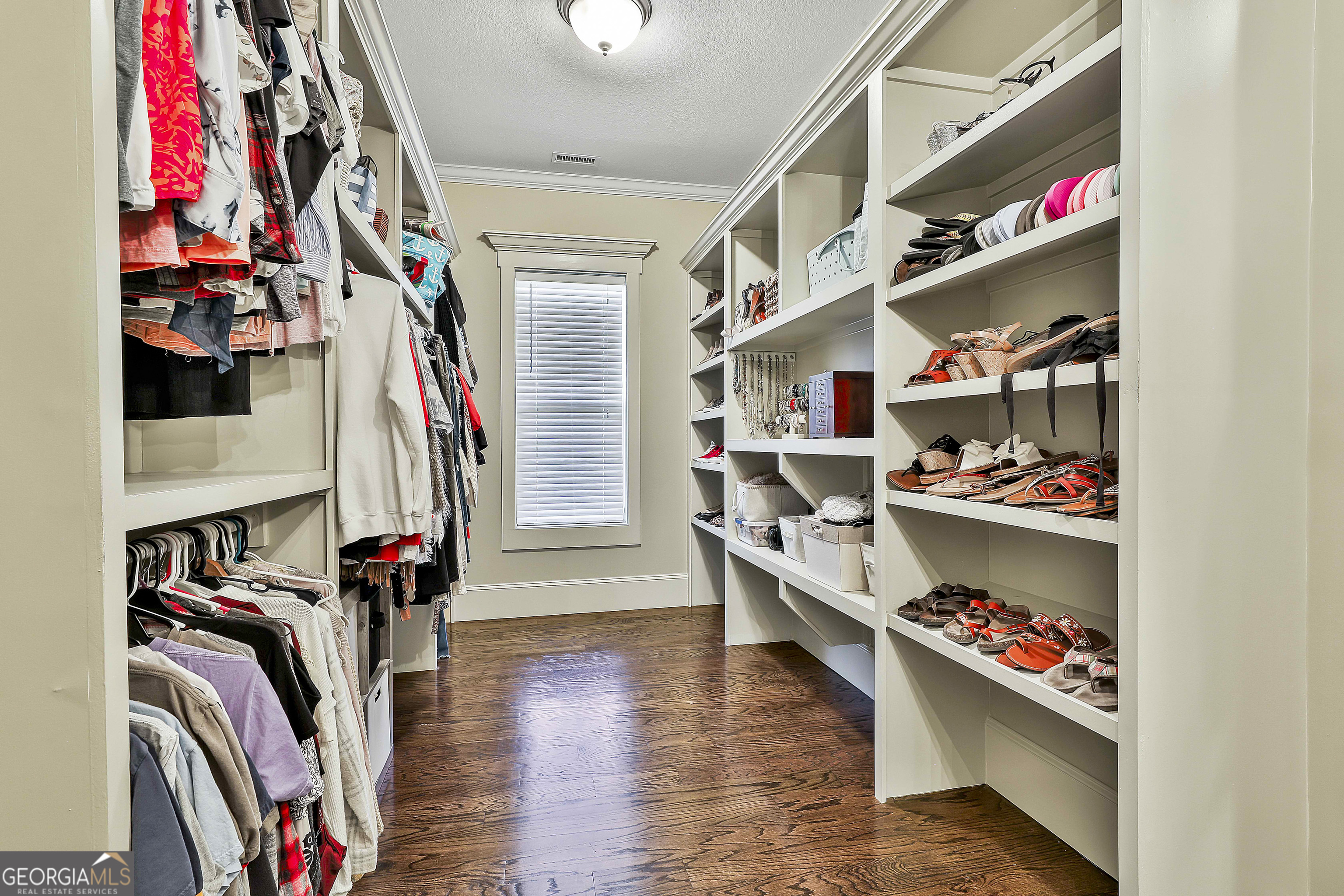 2161 Bear Creek Road Moreland, GA 30259 - Photo 75 of 137 a view of walk in closet with clothes and shoes