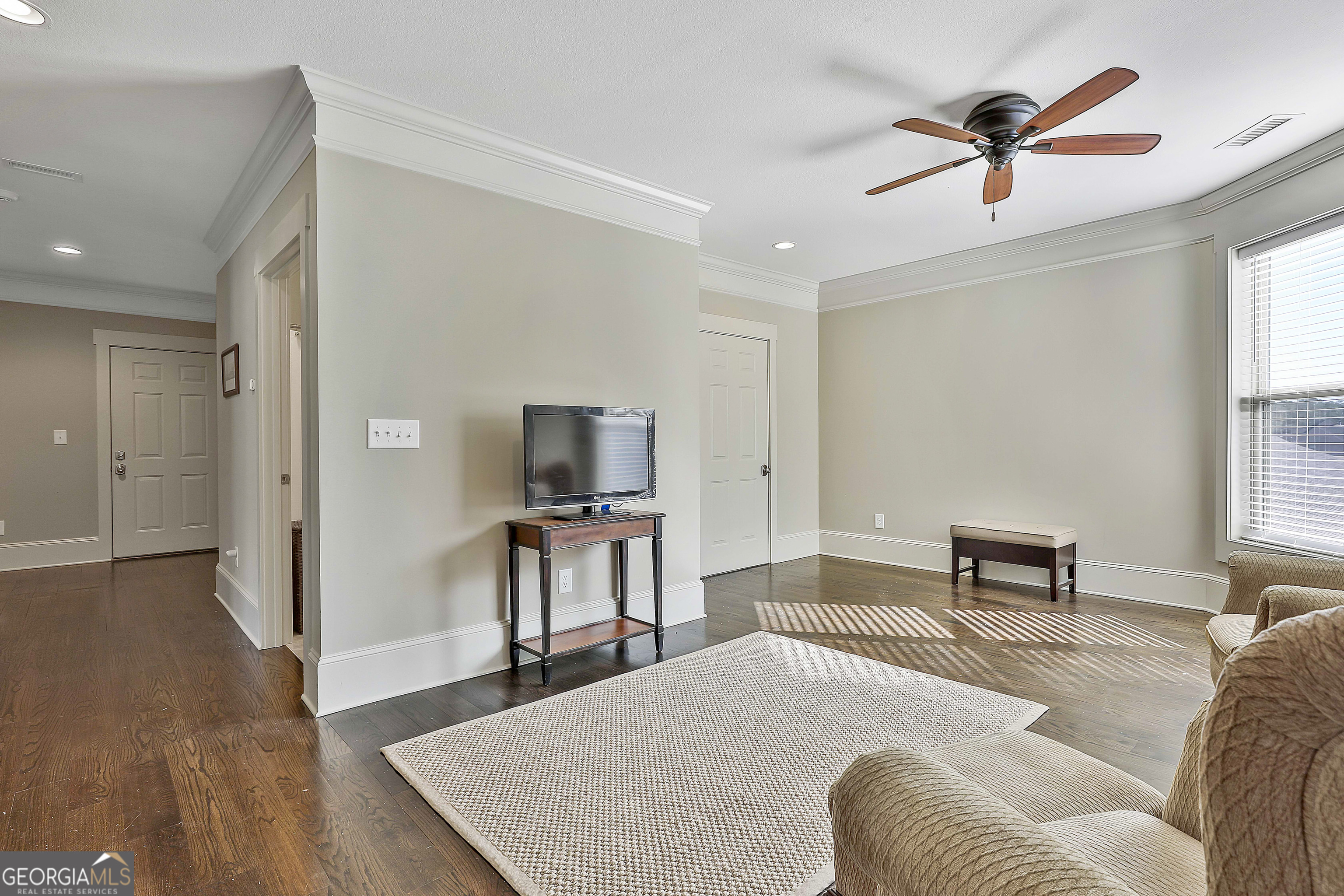 2161 Bear Creek Road Moreland, GA 30259 - Photo 79 of 137 a living room with furniture and a flat screen tv