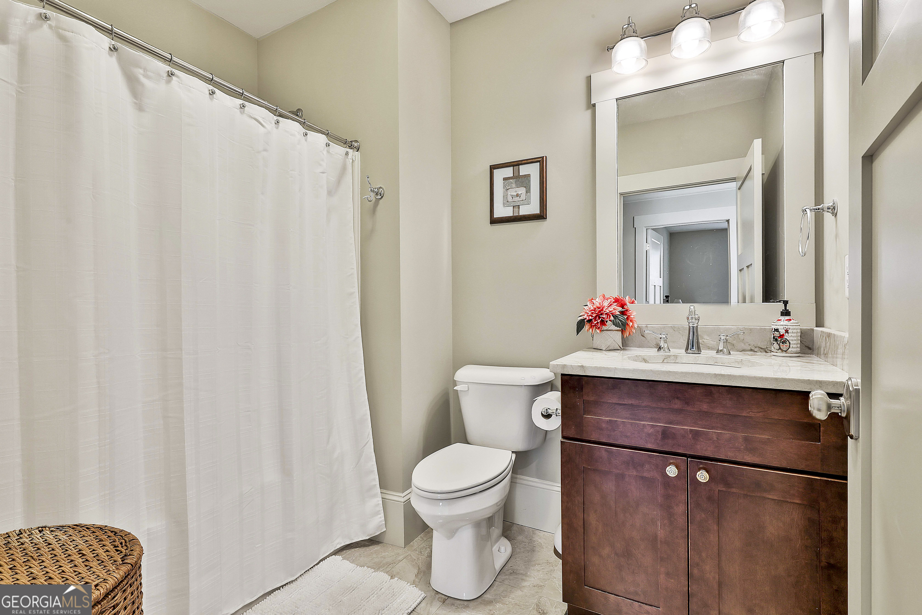 2161 Bear Creek Road Moreland, GA 30259 - Photo 81 of 137 a bathroom with a sink vanity mirror and toilet