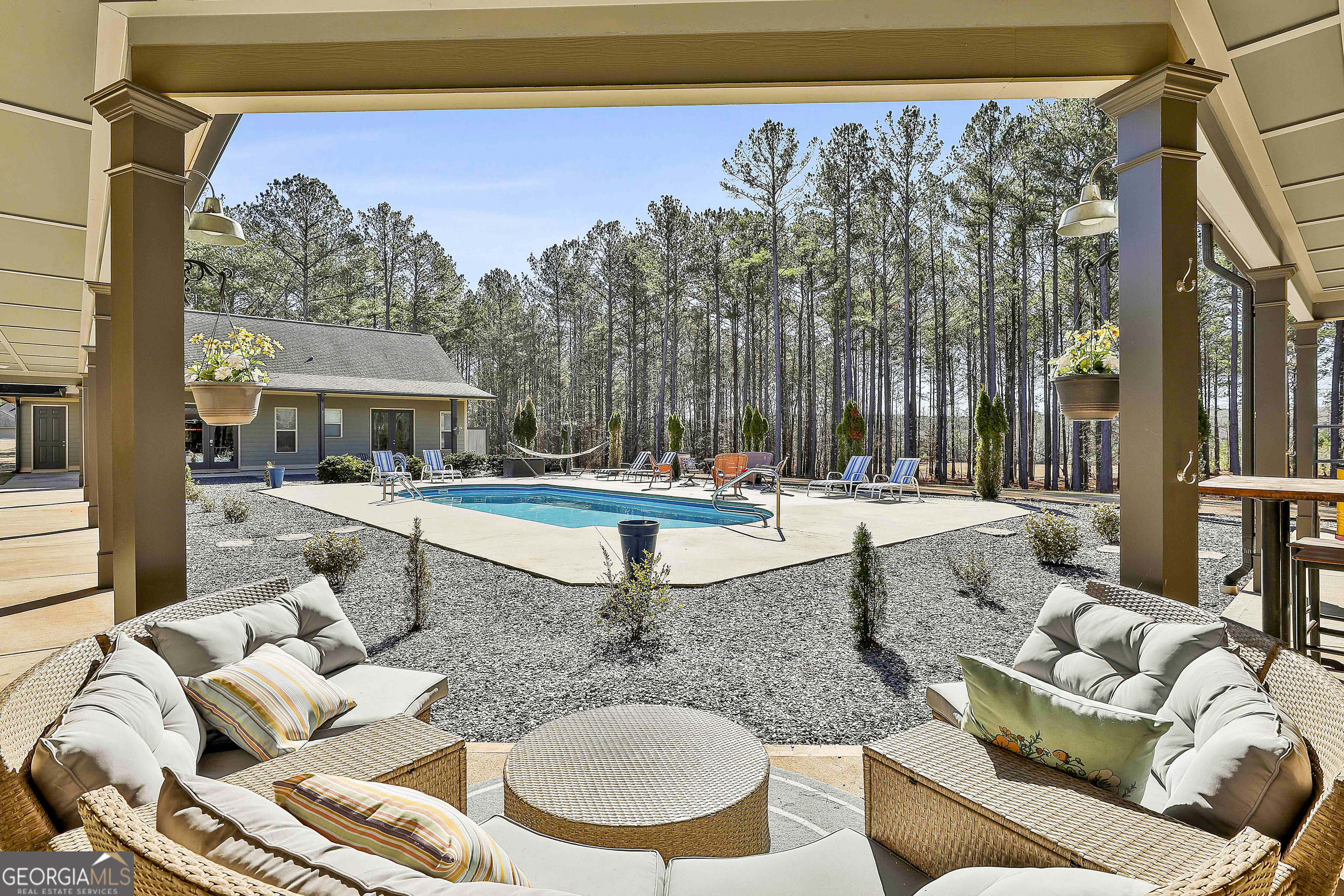 2161 Bear Creek Road Moreland, GA 30259 - Photo 85 of 137 a living room with furniture and a floor to ceiling window