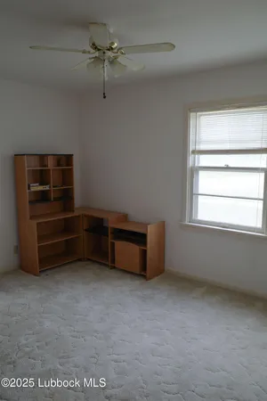 a room with a bed and a window