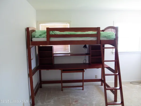 a room with a table and a potted plant