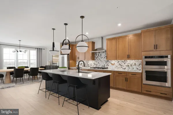 a kitchen with sink cabinets and dining table