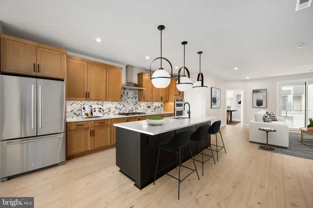 a kitchen with sink cabinets and refrigerator