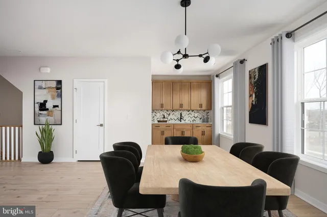 a view of a dining room with furniture and window