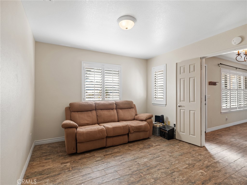 16986 Ocotilla Road Apple Valley, CA 92307 - Photo 15 of 39 a living room with furniture and a window