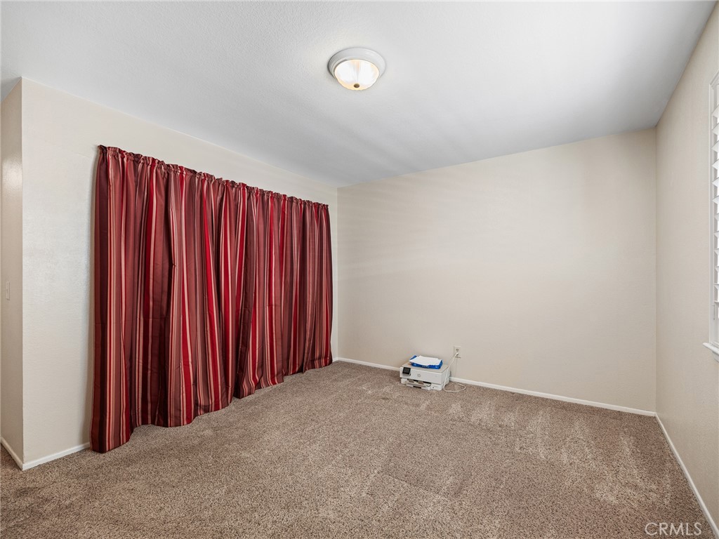 16986 Ocotilla Road Apple Valley, CA 92307 - Photo 20 of 39 a view of a room with a wooden walls