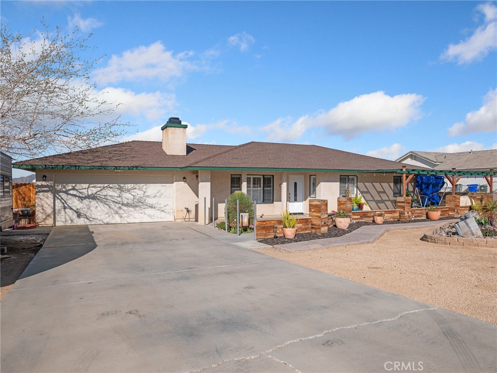 16986 Ocotilla Road Apple Valley, CA 92307 - Photo 2 of 39 a view of a house with sitting area and roof deck
