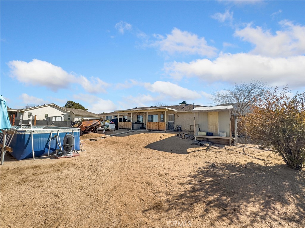 16986 Ocotilla Road Apple Valley, CA 92307 - Photo 31 of 39 a view of a house with wooden fence