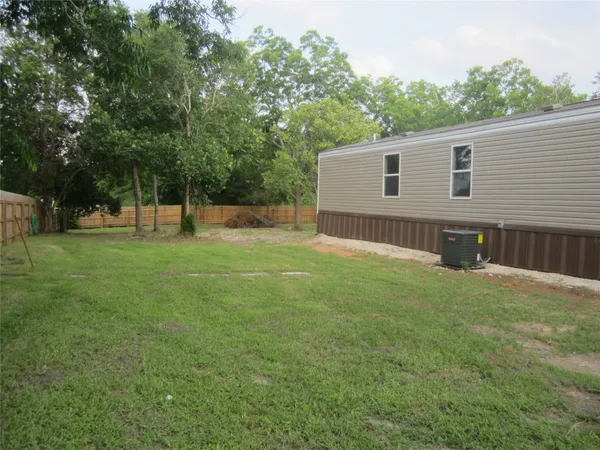 a view of a backyard with a small cabin