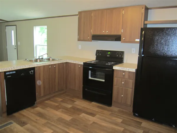 a kitchen with a sink and a stove