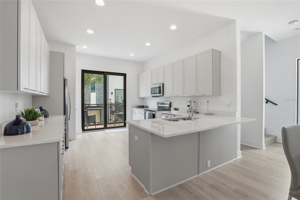 4810 West McElroy Avenue, Unit 30 Tampa, FL 33611 - Photo 2 of 43 a kitchen with sink and cabinets
