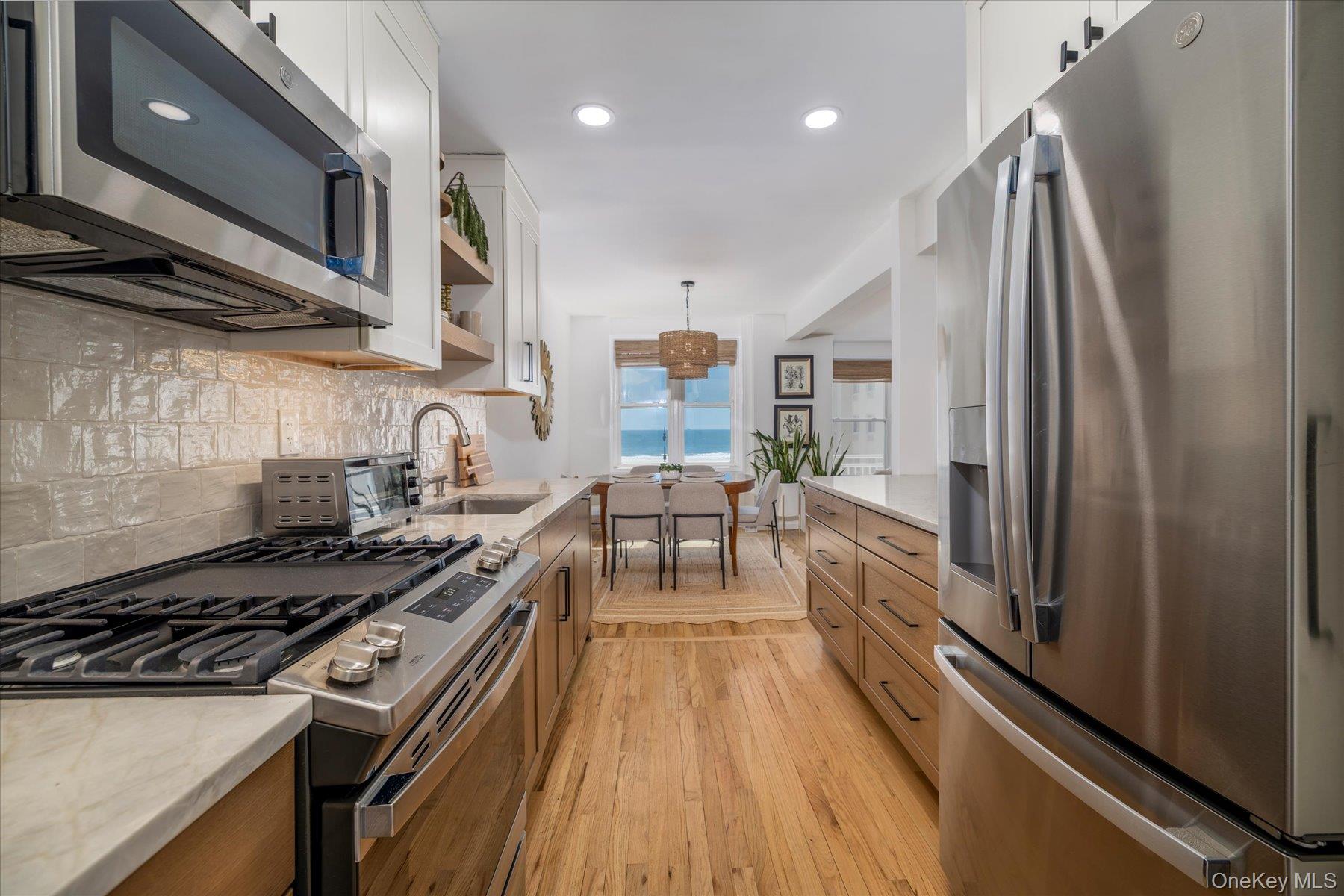 522 Shore Road, Unit 3AA Long Beach, NY 11561 - Photo 9 of 30 Kitchen with Stainless Steel Appliance and Gas Cooking
