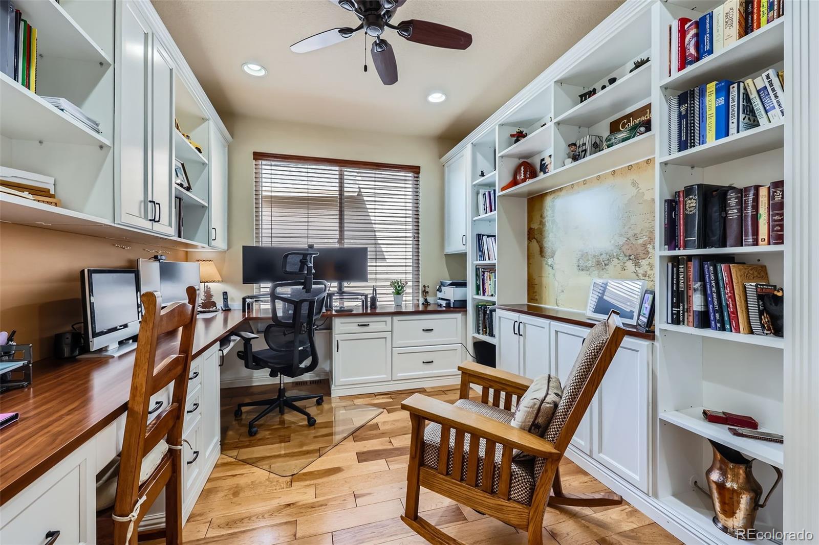 2872 Dreamcatcher Loop Castle Rock, CO 80109 - Photo 18 of 42 a view of a workspace with furniture and a book shelf