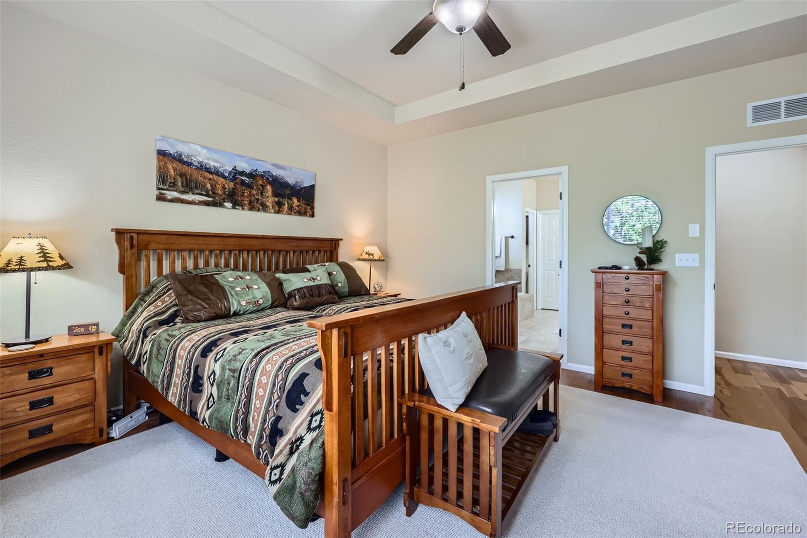 2872 Dreamcatcher Loop Castle Rock, CO 80109 - Photo 22 of 42 a bedroom with bed and wooden floor