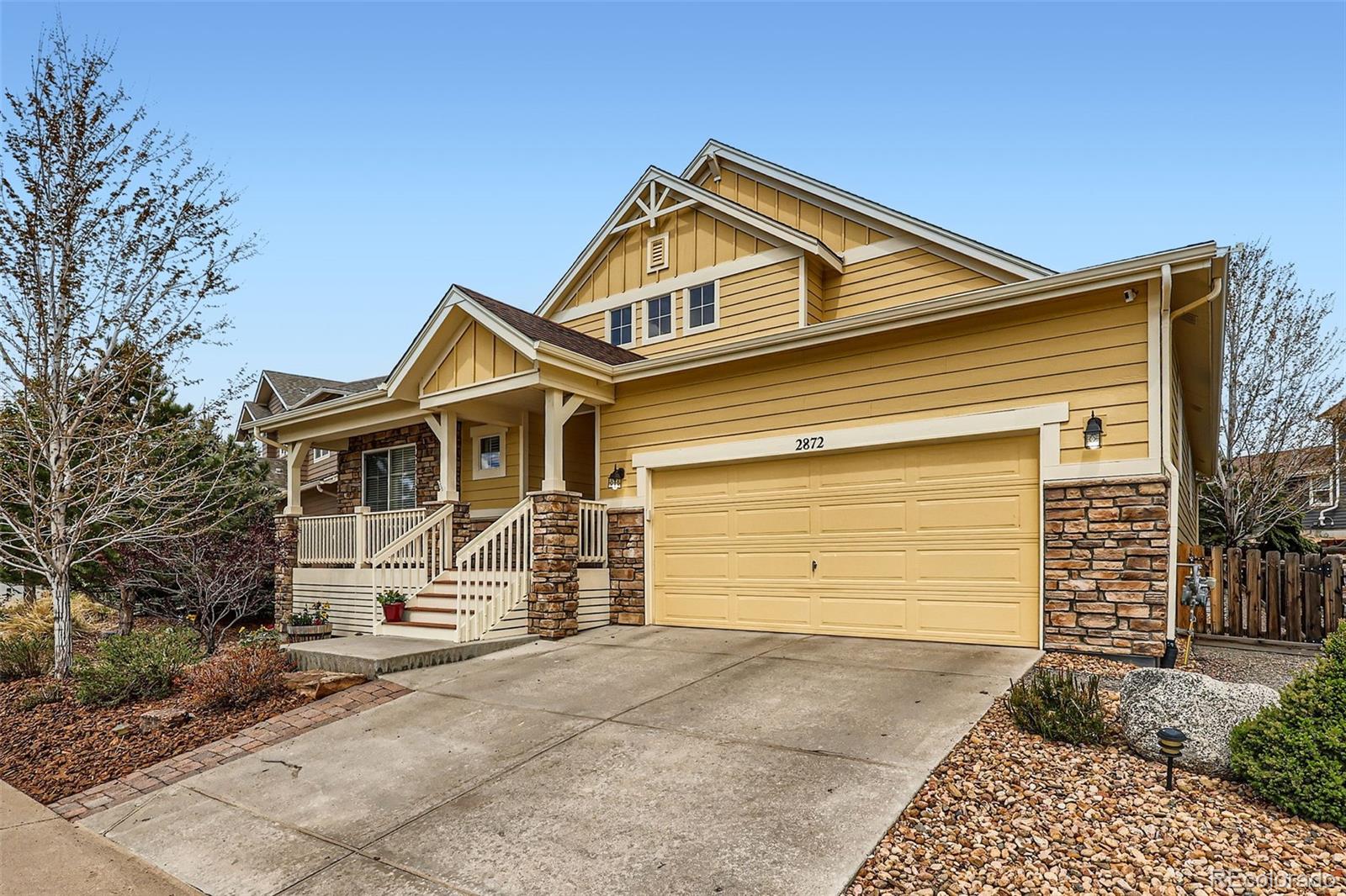 2872 Dreamcatcher Loop Castle Rock, CO 80109 - Photo 42 of 42 a front view of a house with a yard and garage