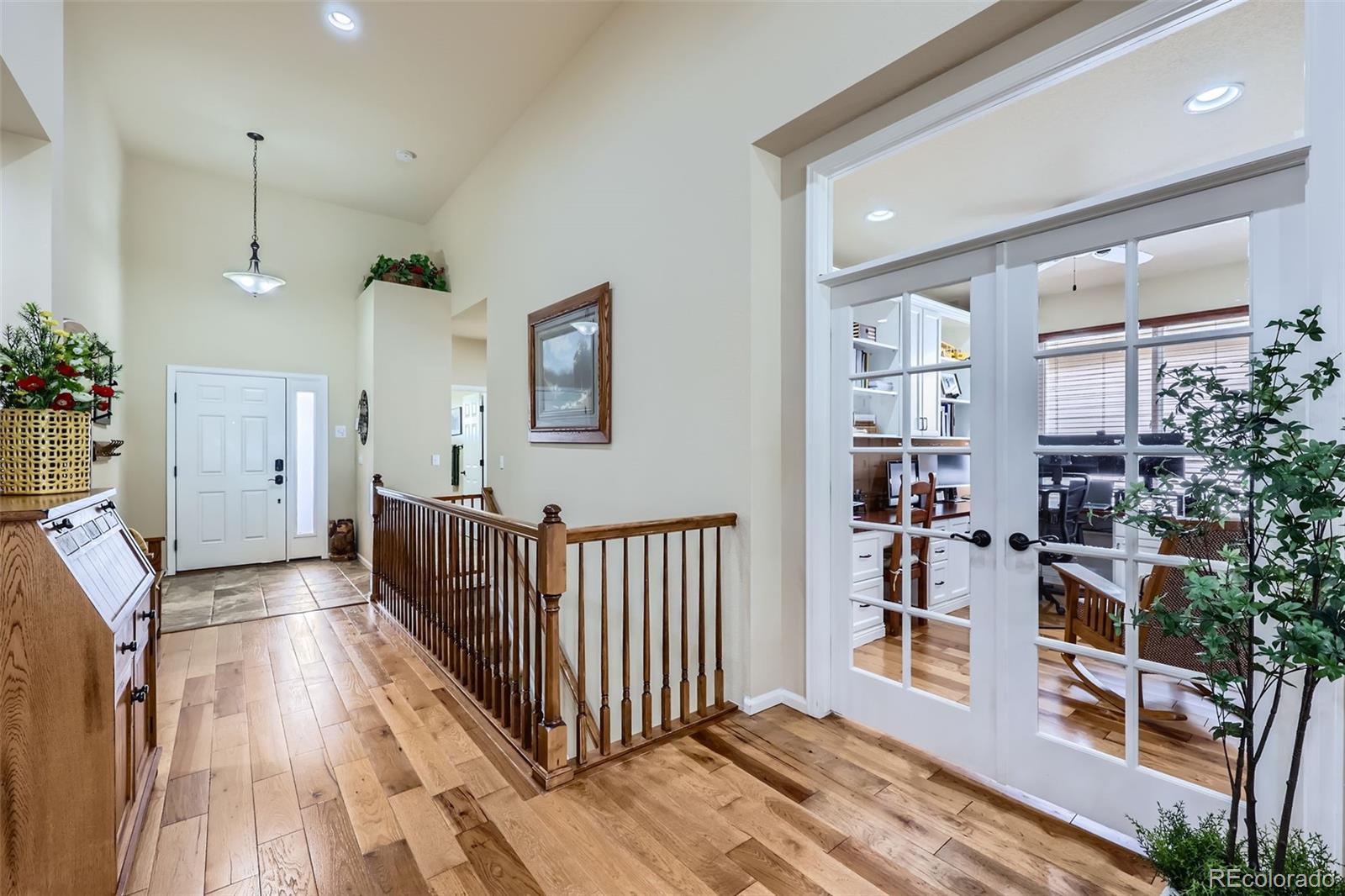 2872 Dreamcatcher Loop Castle Rock, CO 80109 - Photo 5 of 42 a view of a livingroom with furniture and staircase