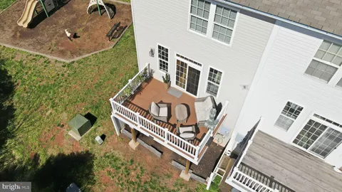 an aerial view of a house with a swimming pool