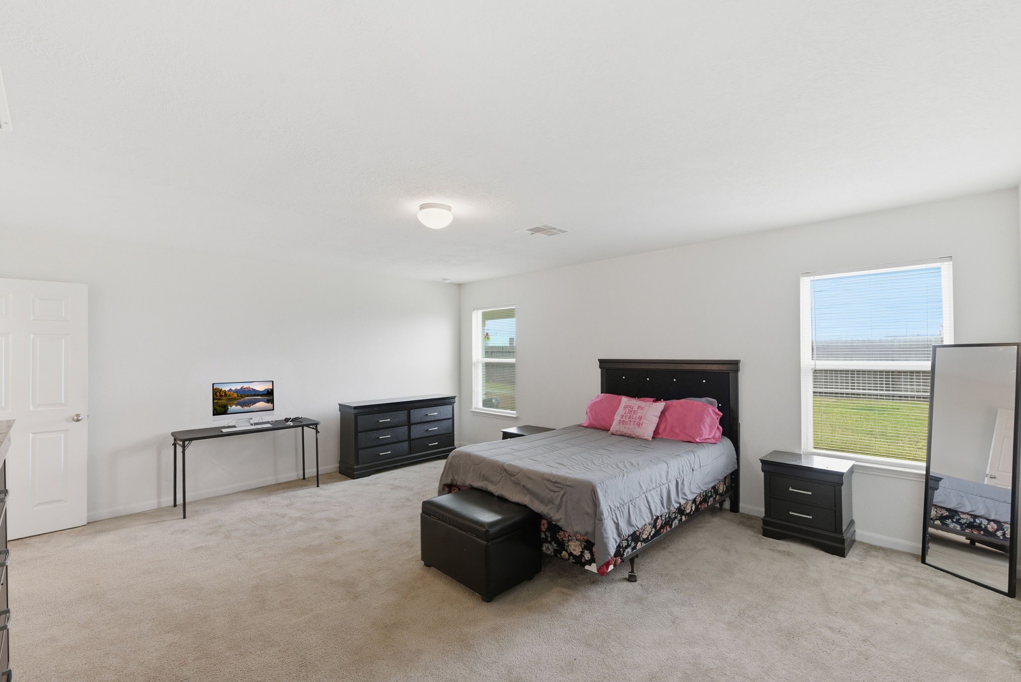 2607 Little Bluestem Lane Rosenberg, TX 77469 - Photo 11 of 20 a spacious bedroom with a bed and furniture