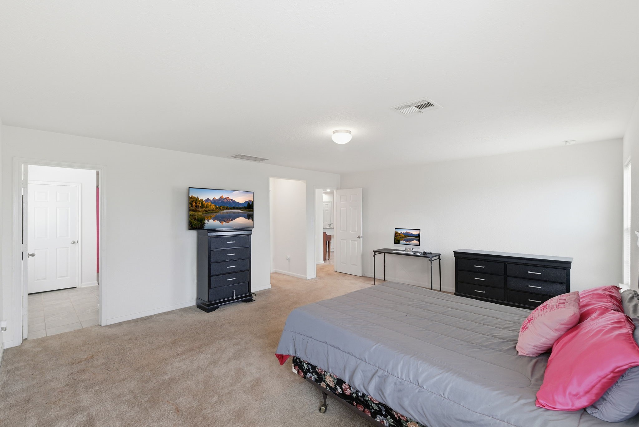 2607 Little Bluestem Lane Rosenberg, TX 77469 - Photo 12 of 20 a bedroom with bed and dresser