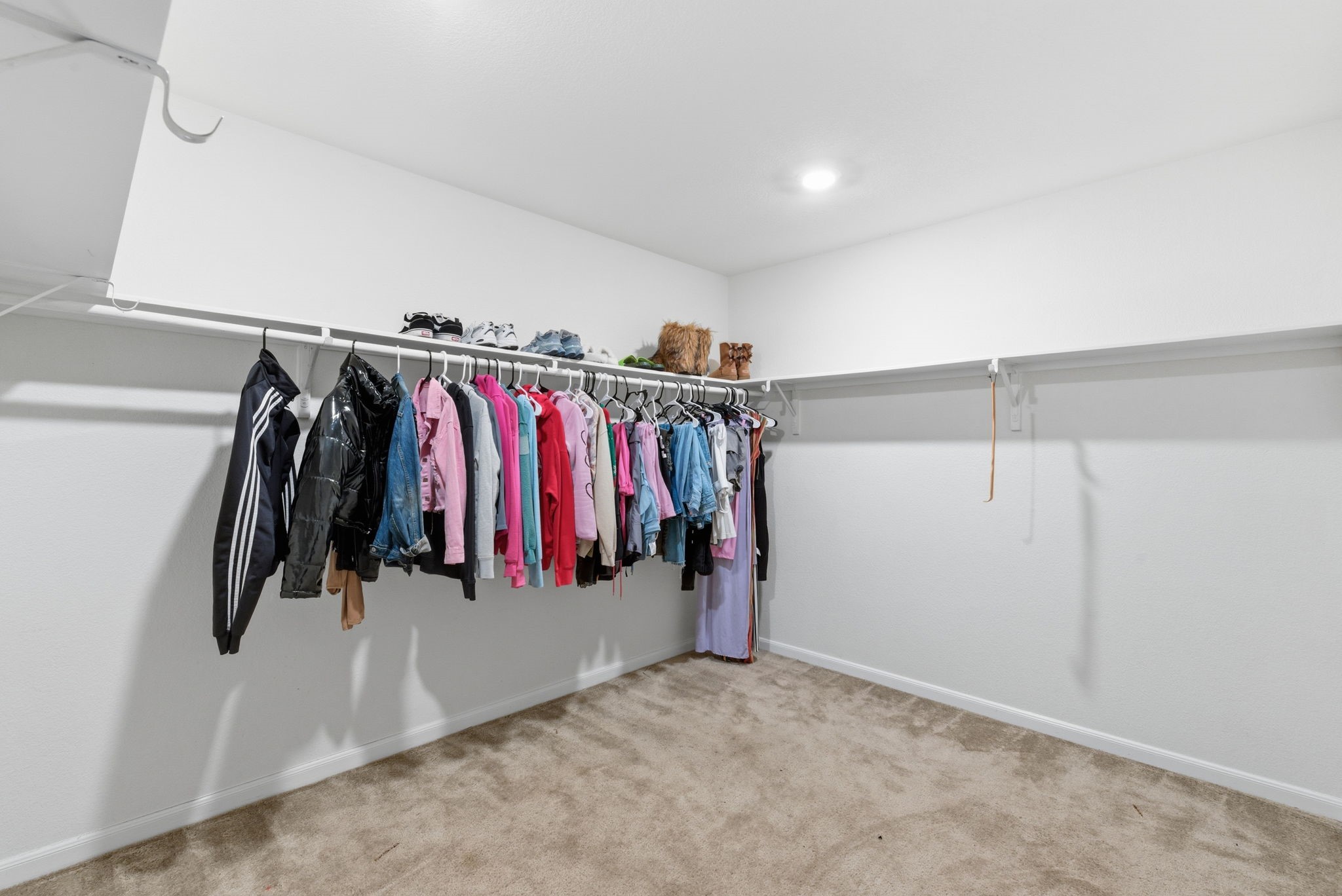 2607 Little Bluestem Lane Rosenberg, TX 77469 - Photo 13 of 20 a view of walk in closet with clothes
