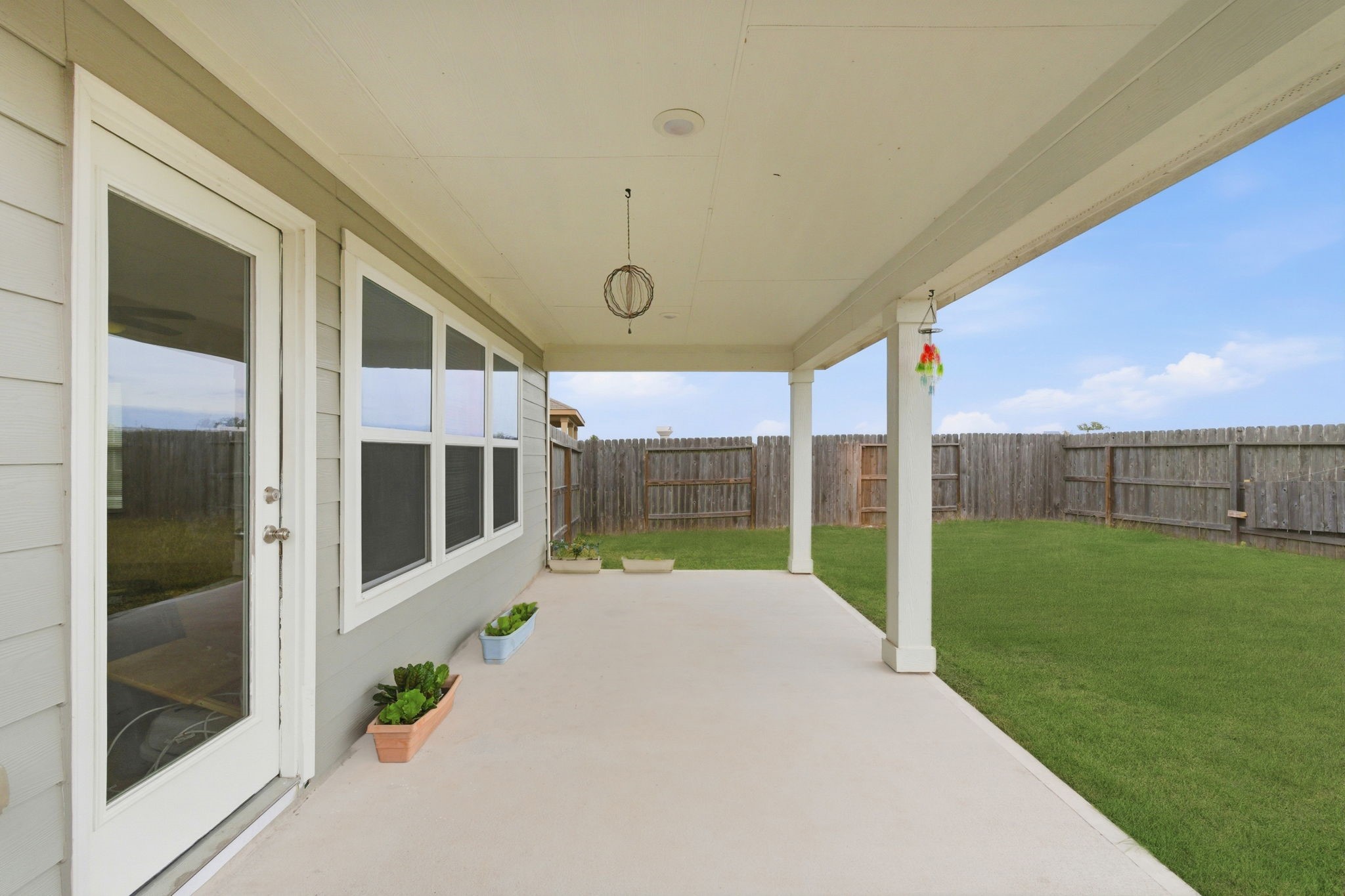 2607 Little Bluestem Lane Rosenberg, TX 77469 - Photo 17 of 20 a view of a porch with furniture and garden