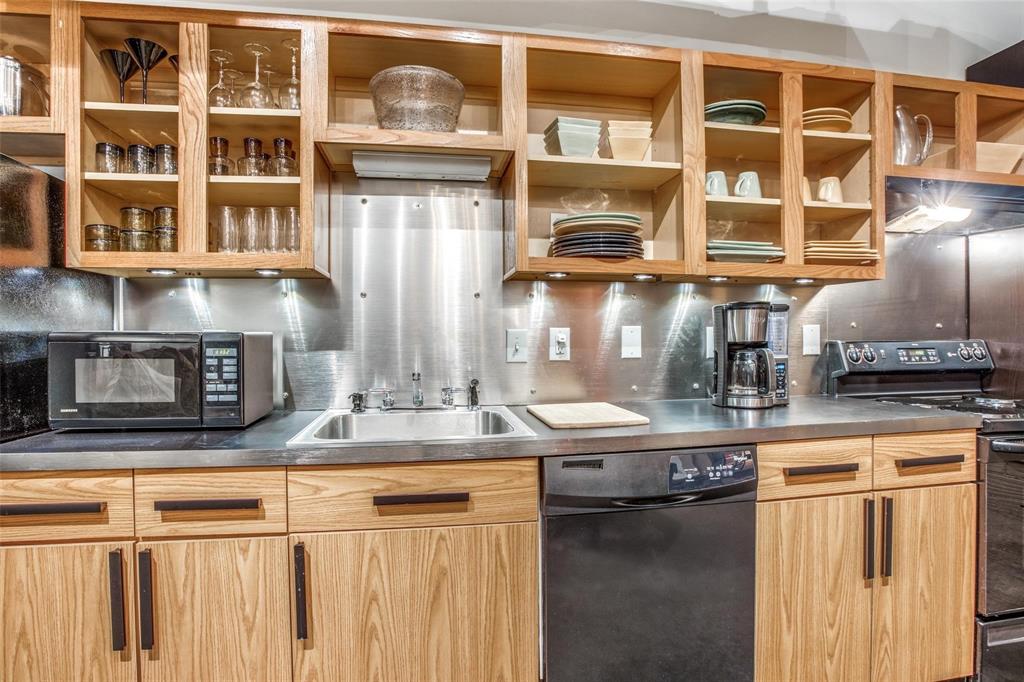 1122 Jackson Street, Unit 322 Dallas, TX 75202 - Photo 14 of 25 a kitchen with a stove and a microwave