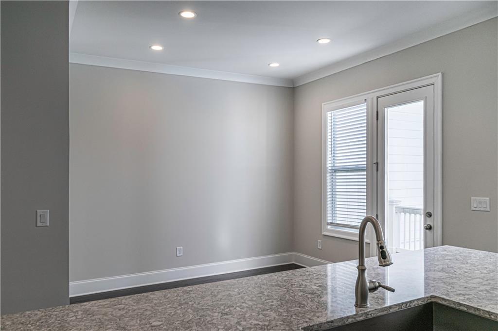 2006 Attell Way Decatur, GA 30033 - Photo 12 of 35 a view of a room with a large window and wooden floor