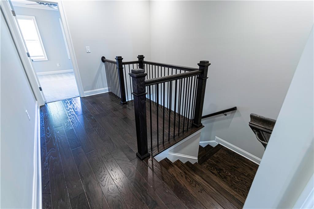2006 Attell Way Decatur, GA 30033 - Photo 16 of 35 a view of a livingroom with wooden floor and stairs