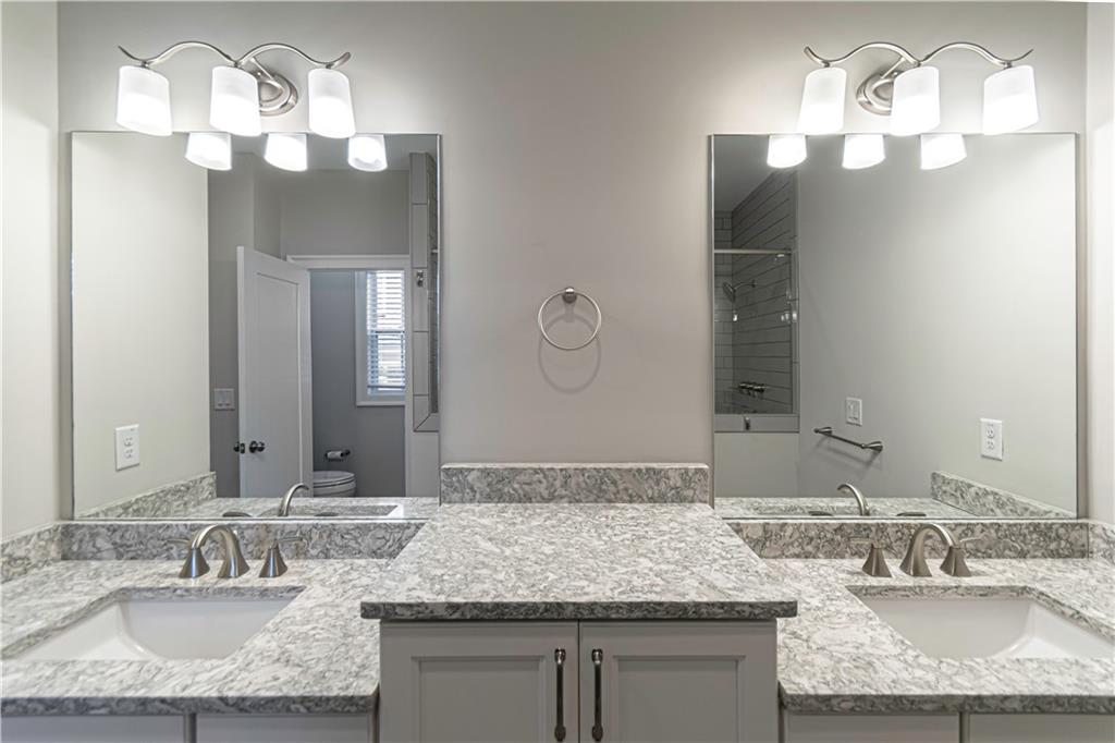 2006 Attell Way Decatur, GA 30033 - Photo 20 of 35 a bathroom with a granite countertop double vanity sinks and a mirror