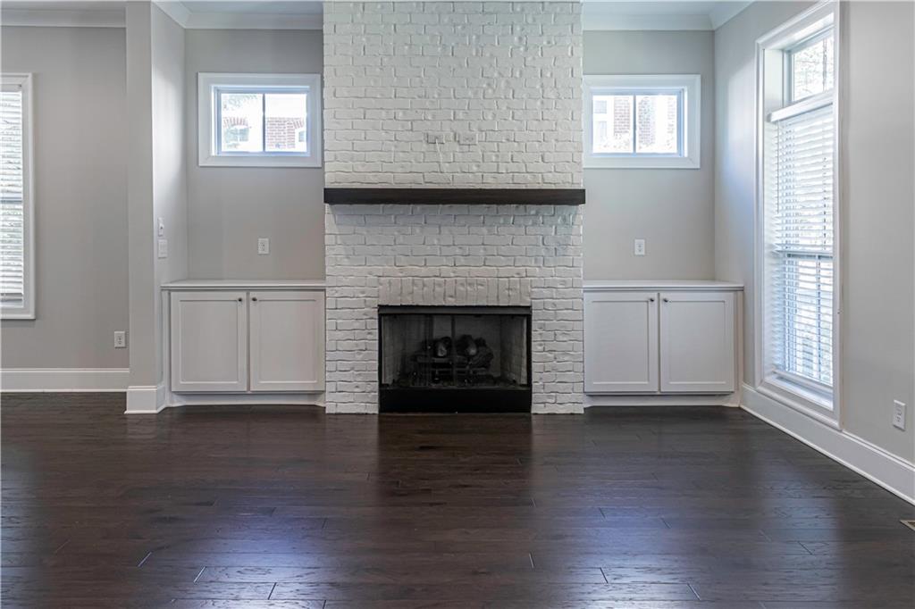 2006 Attell Way Decatur, GA 30033 - Photo 6 of 35 a view of a livingroom with wooden floor and a fireplace
