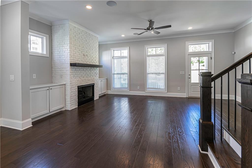 2006 Attell Way Decatur, GA 30033 - Photo 7 of 35 an empty room with wooden floor fireplace and windows