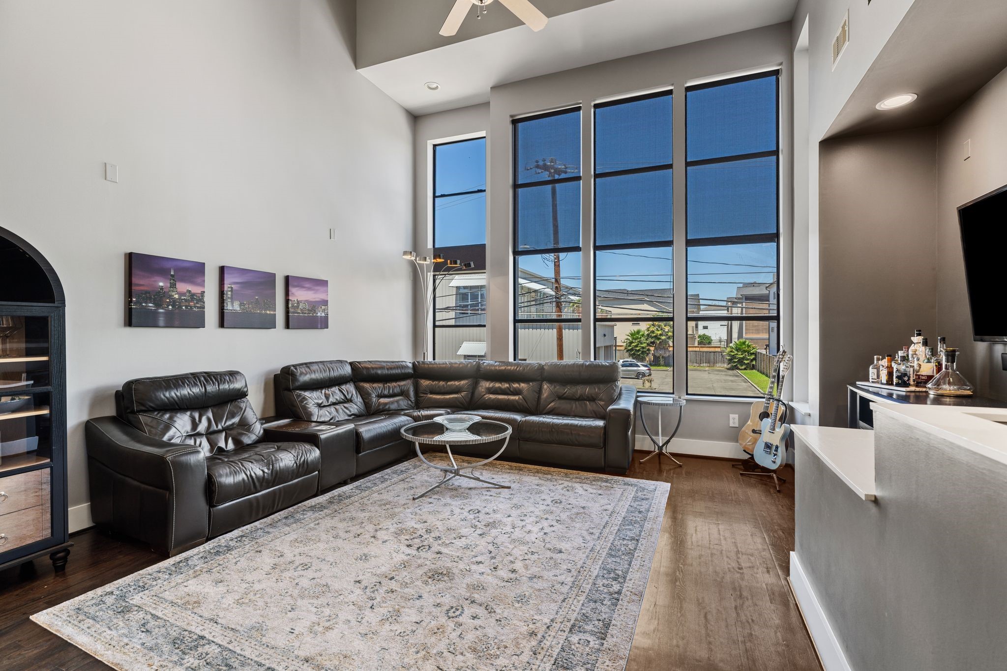 1039 Bonner Street, Unit 1039 Houston, TX 77007 - Photo 3 of 19 The large living area has great views with a wall of windows. Spacious feeling.