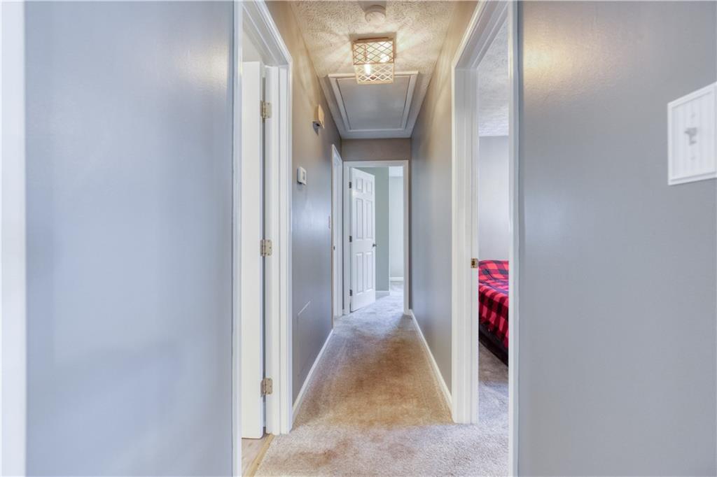 23 Woodland Road Auburn, GA 30011 - Photo 17 of 34 a view of a hallway with a elevator