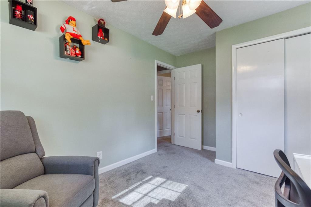 23 Woodland Road Auburn, GA 30011 - Photo 22 of 34 a view of livingroom with furniture and workspace