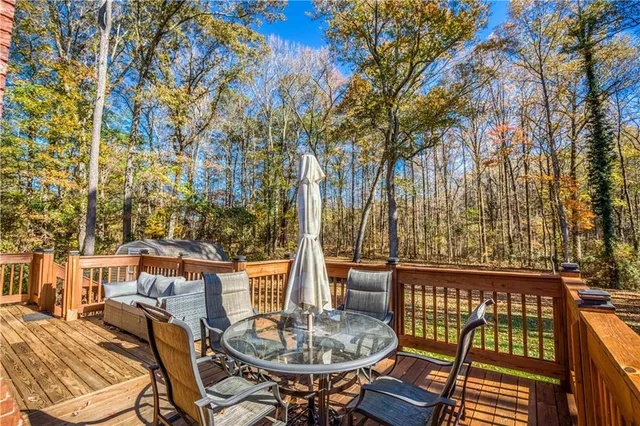 a view of a patio with a table and chairs