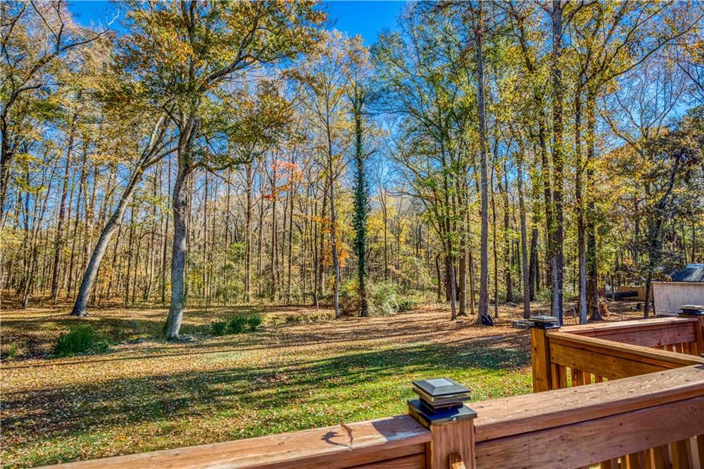 23 Woodland Road Auburn, GA 30011 - Photo 3 of 34 a view of a yard with large trees