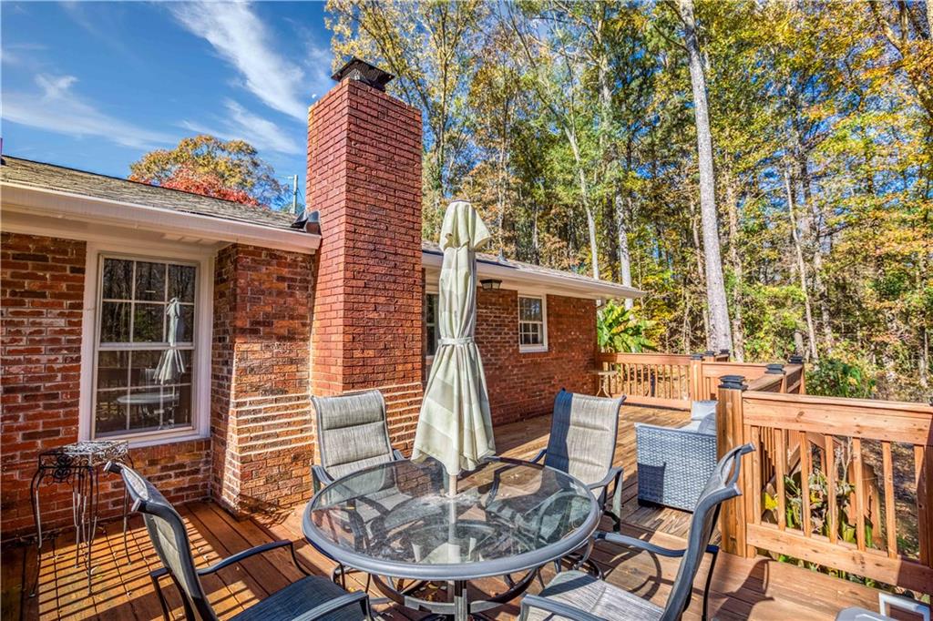 23 Woodland Road Auburn, GA 30011 - Photo 31 of 34 a view of a patio with a table and chairs
